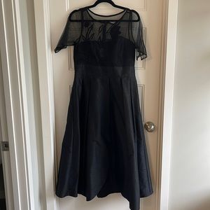 Gorgeous black tulip dress with embroidered top and pockets! Size 12